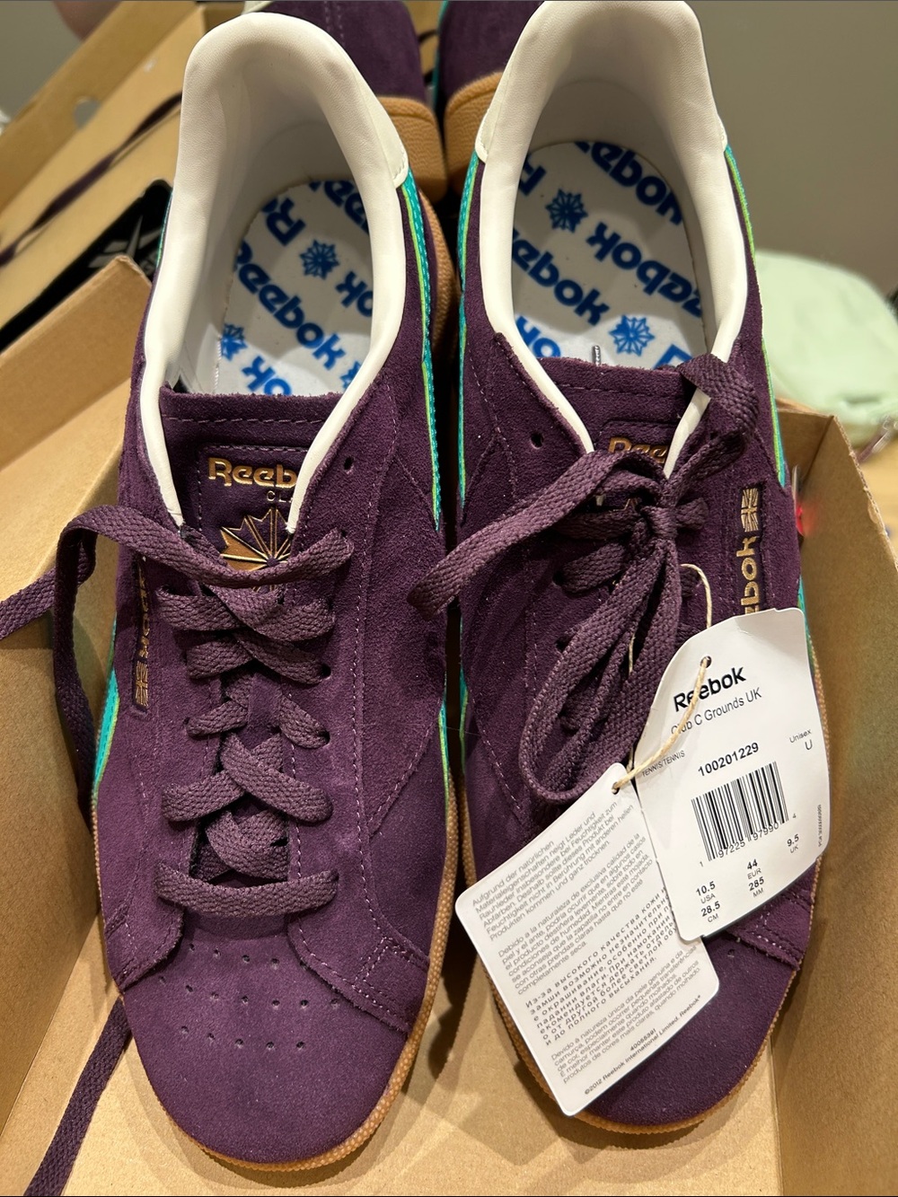 Reebok Men's Suede Sneaker in Burgundy with Teal Stripes.